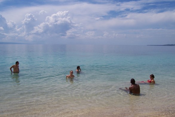 friends in the water at wahoo bay haiti