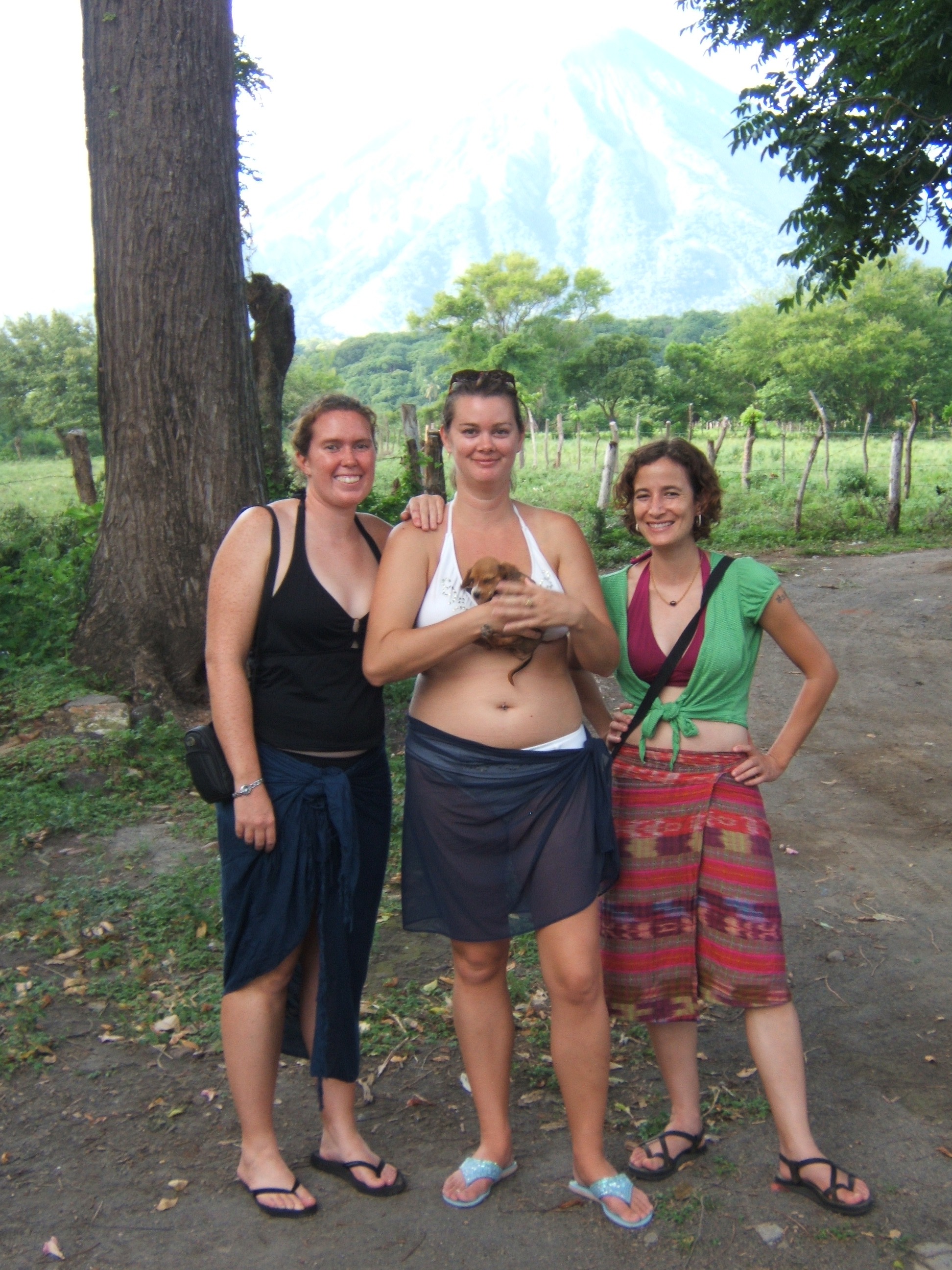 three girls with puppy and Omotepe volcano in background nicaragua