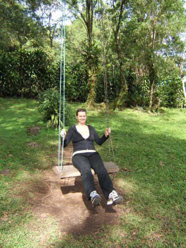 girl on swing at selva negra nicaragua