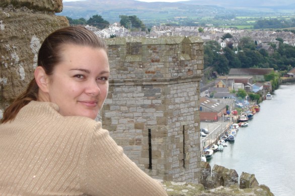 girl atop caernarvon wales castle