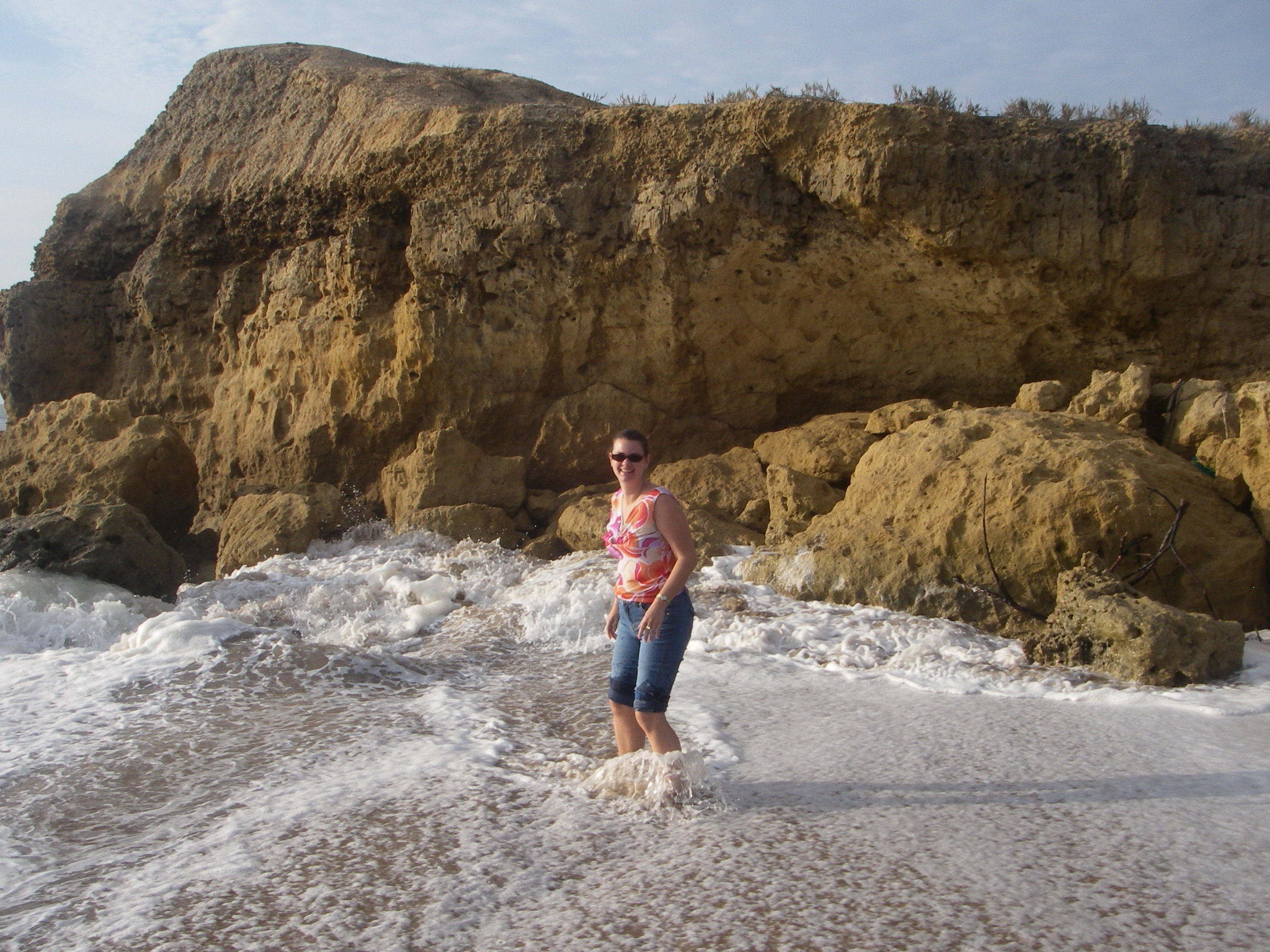 girl playing in surf beach angola