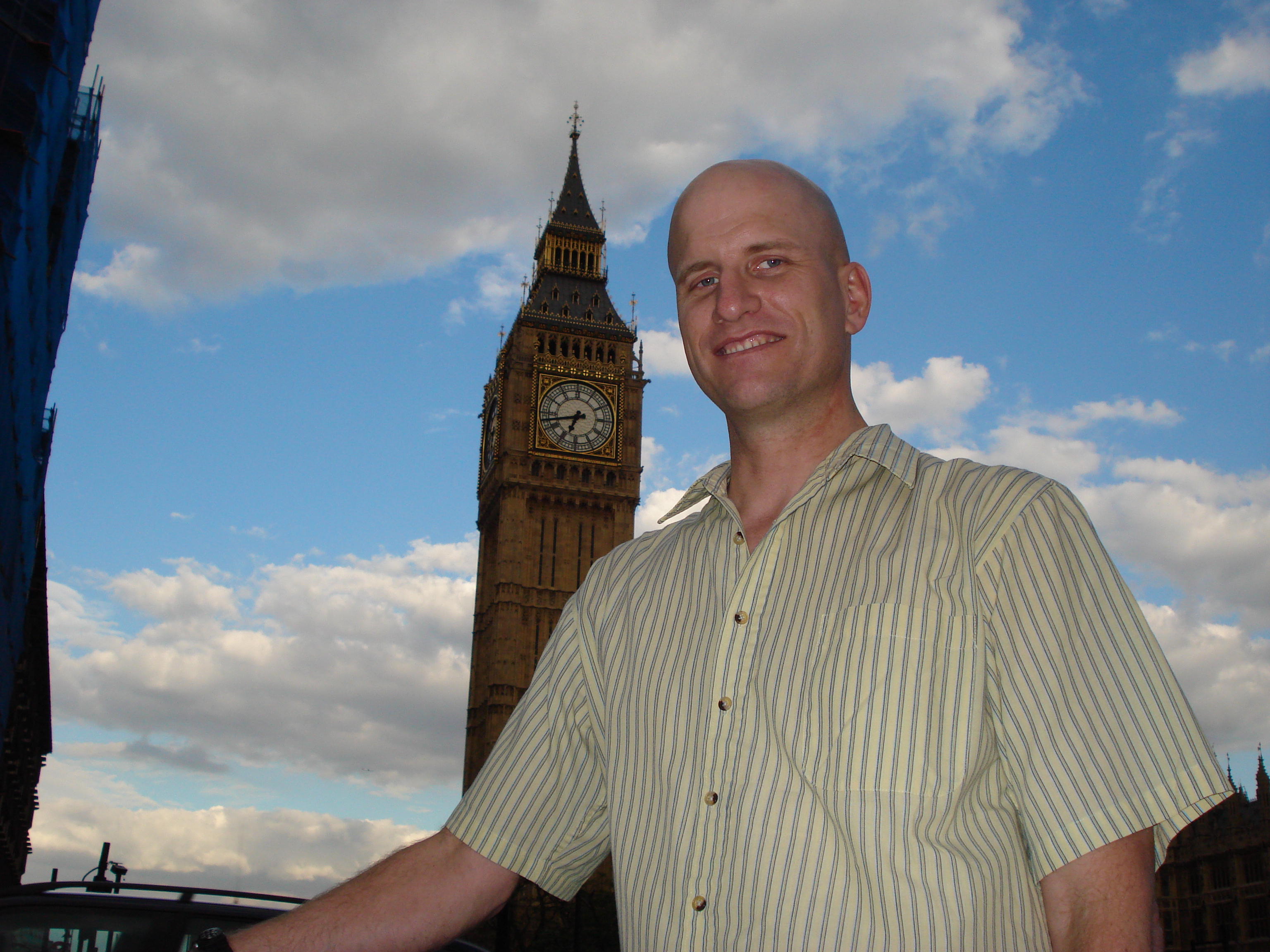 standing in front of Big Ben clock England London