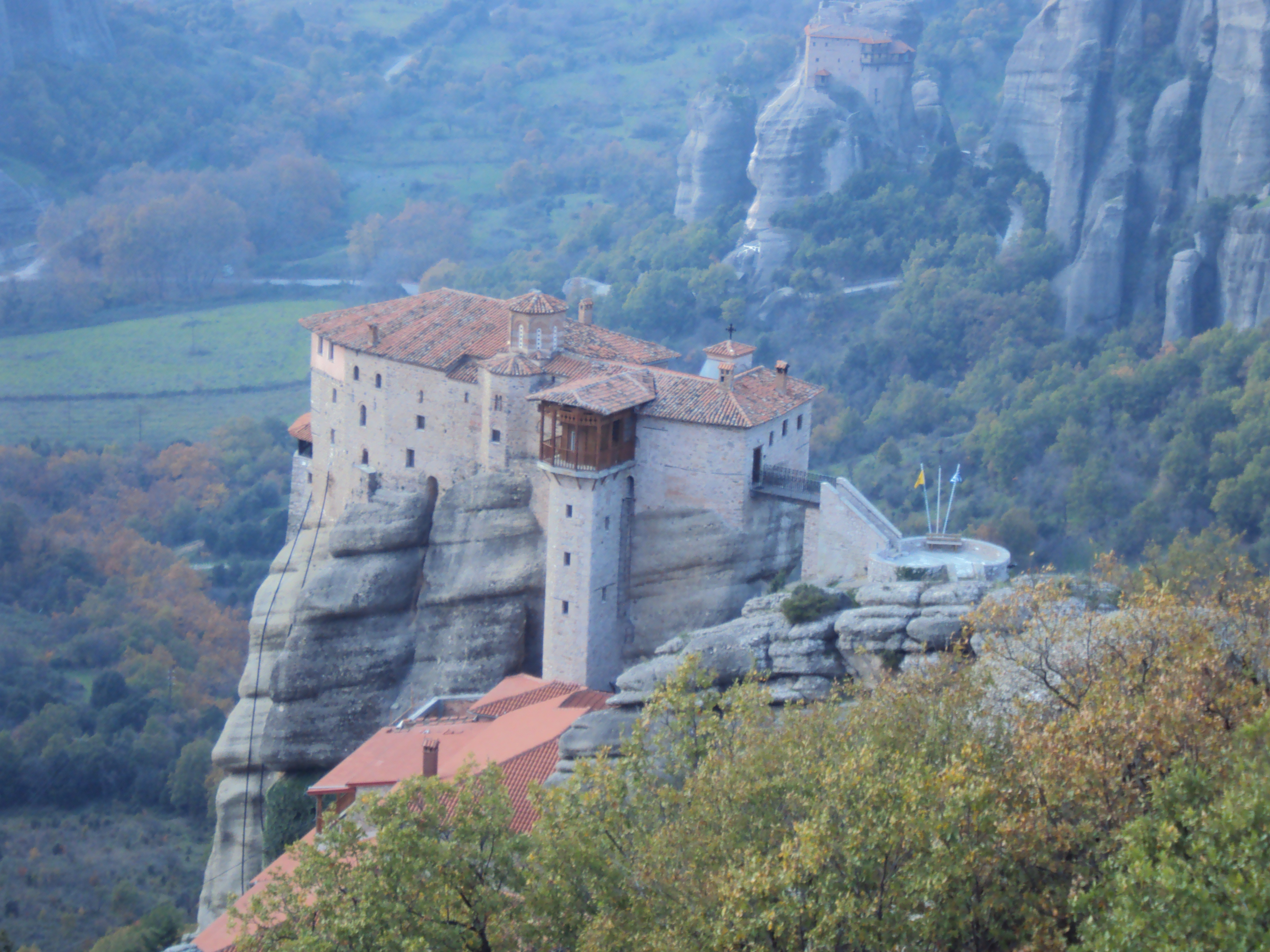 overview of monastery perched on mountaintop meteora greece