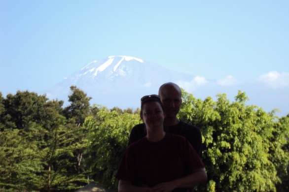 couple at bottom of mount kilimanjaro tanzania
