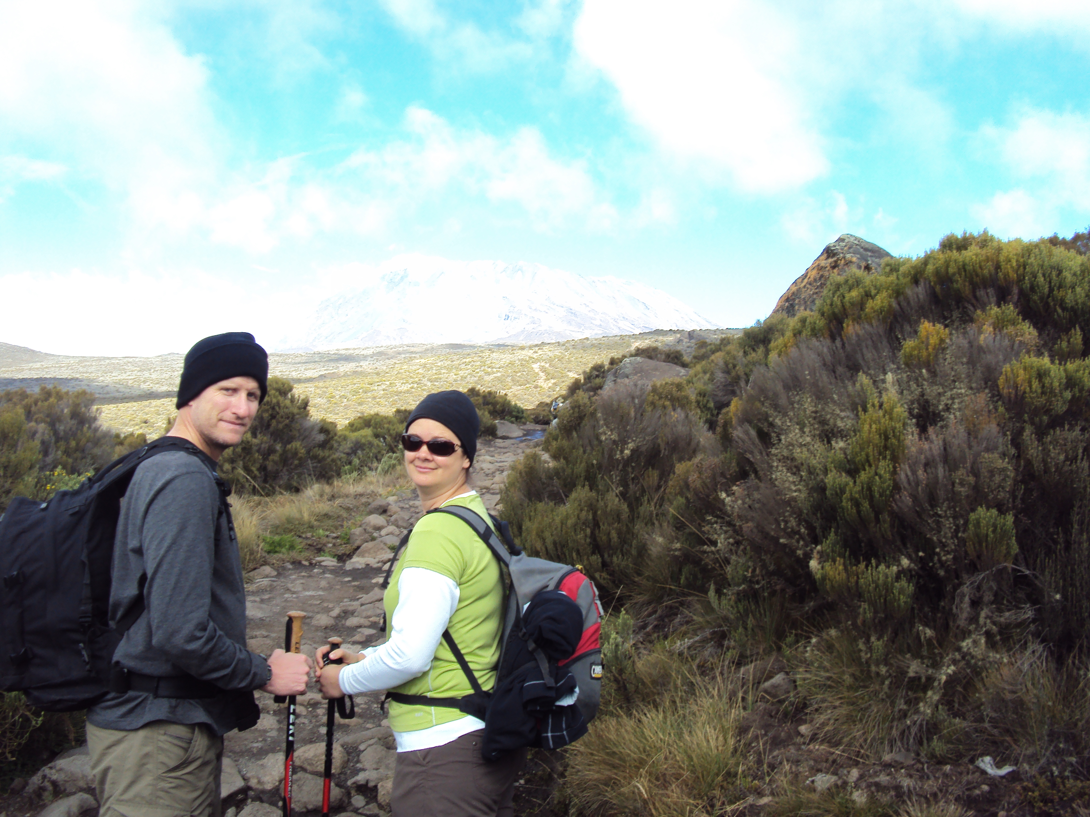 couple halfway up mount kilimanjaro tanzania marangu route