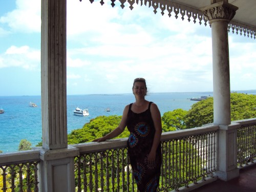 girl standing on balcony zanzibar tanzania