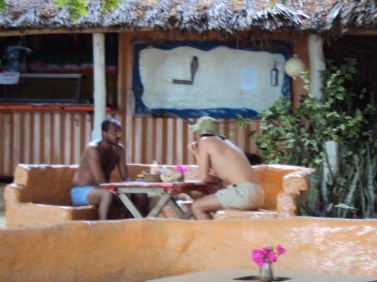 boys sitting at table mombasa beach kenya