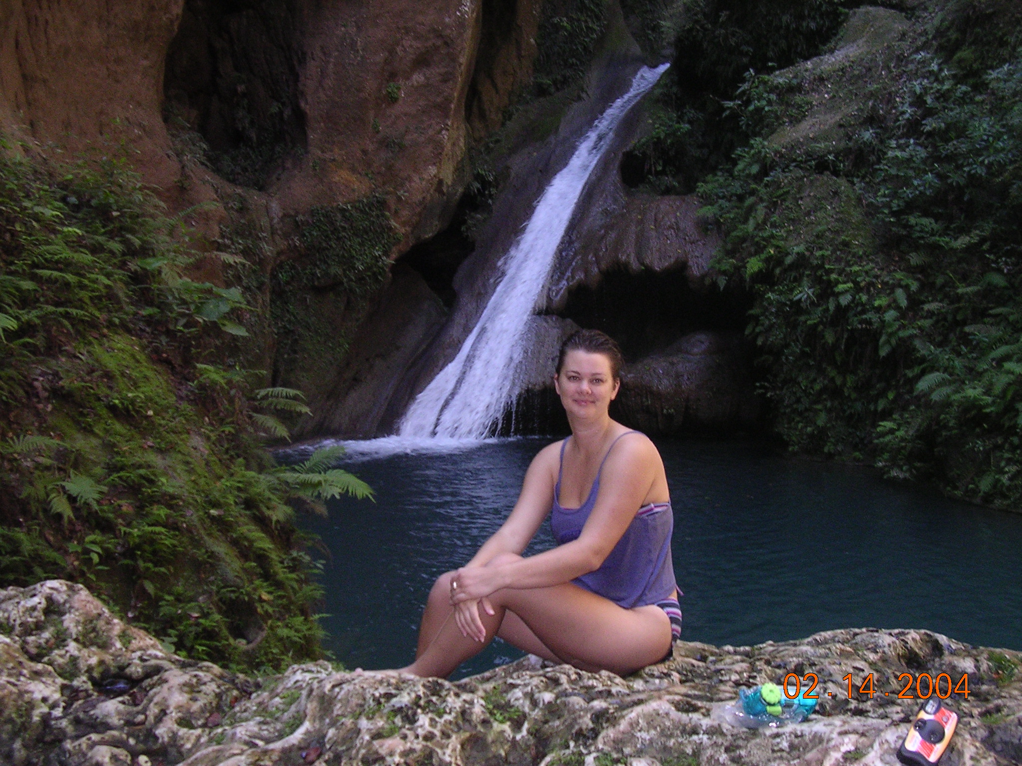 girl in front of waterfall at Bassin Bleu Haiti near Jacmel