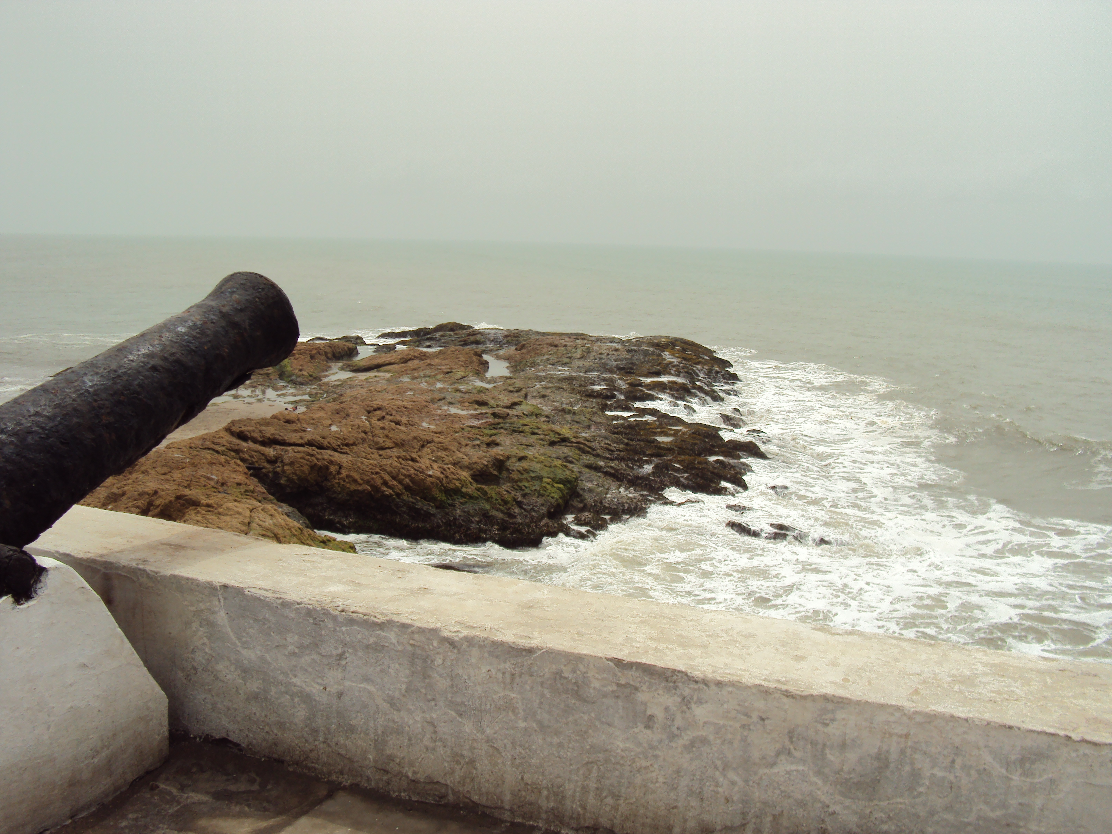 cannon and coastline cape coast slave castle ghana africa