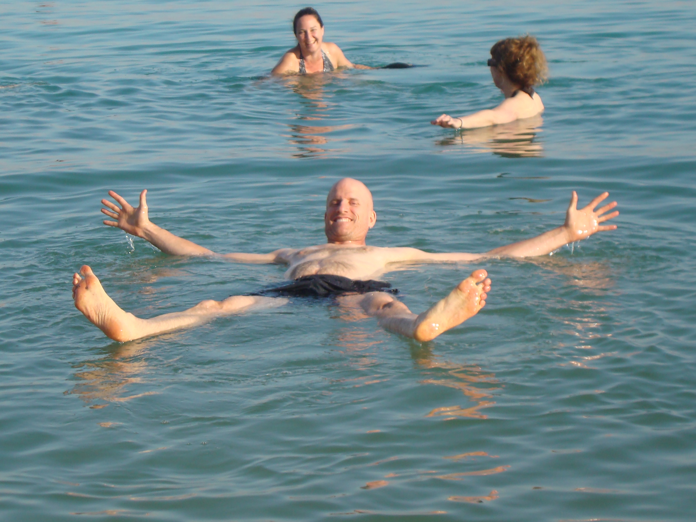 man floating in dead sea israel