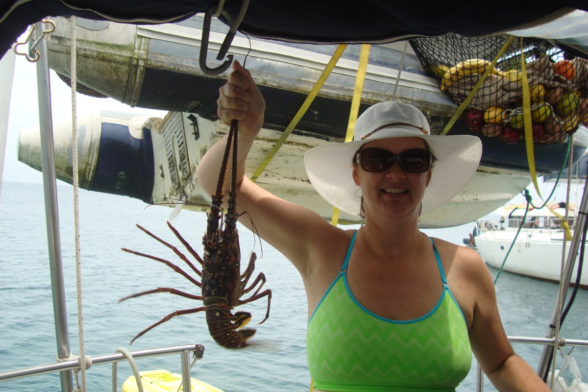 woman with lobster sailboat panama sailing