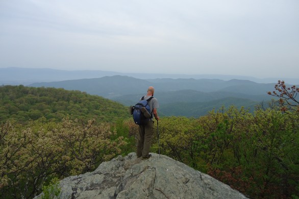 Hiker faces a row of mountains on the appalachian trail