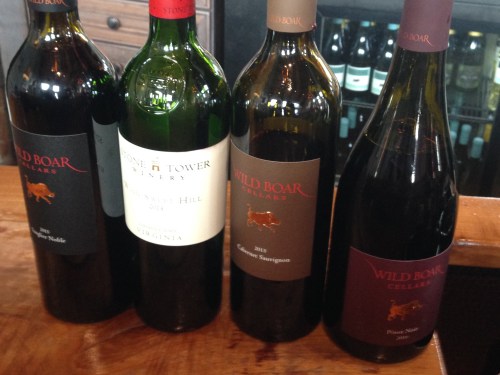 four wine bottles Stone Tower Winery