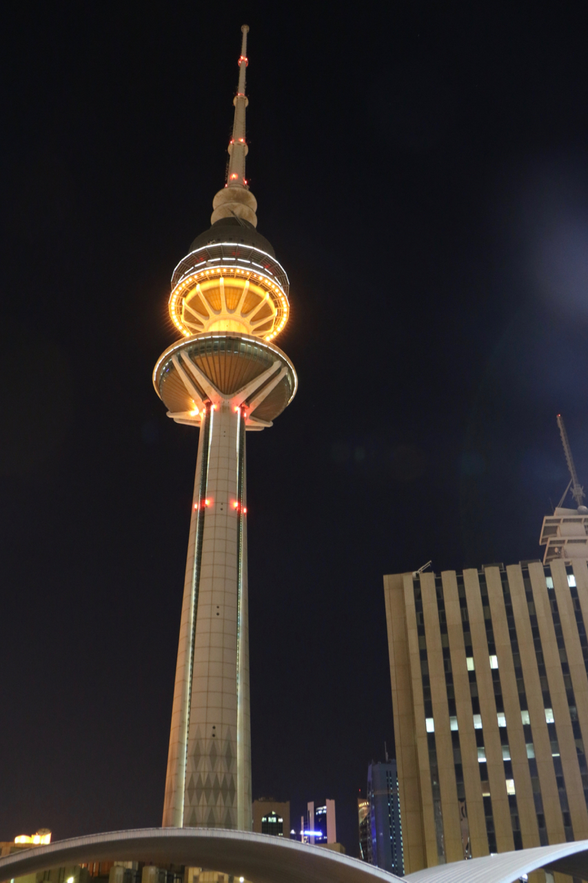 Kuwait Towers lit up at night