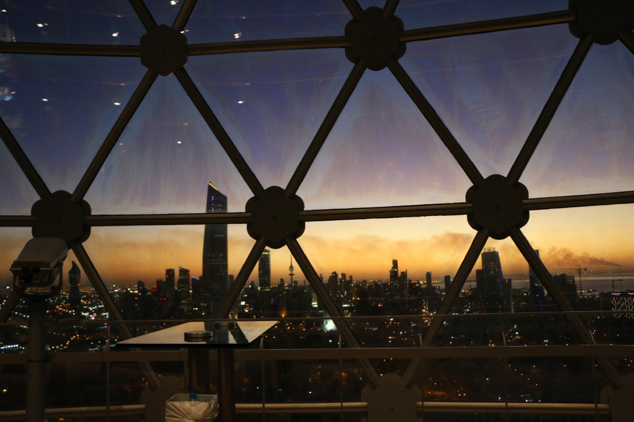 inside kuwait tower oil burning horizon sunset