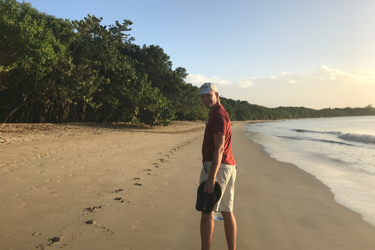 Chris walking beach Tobago horse tracks
