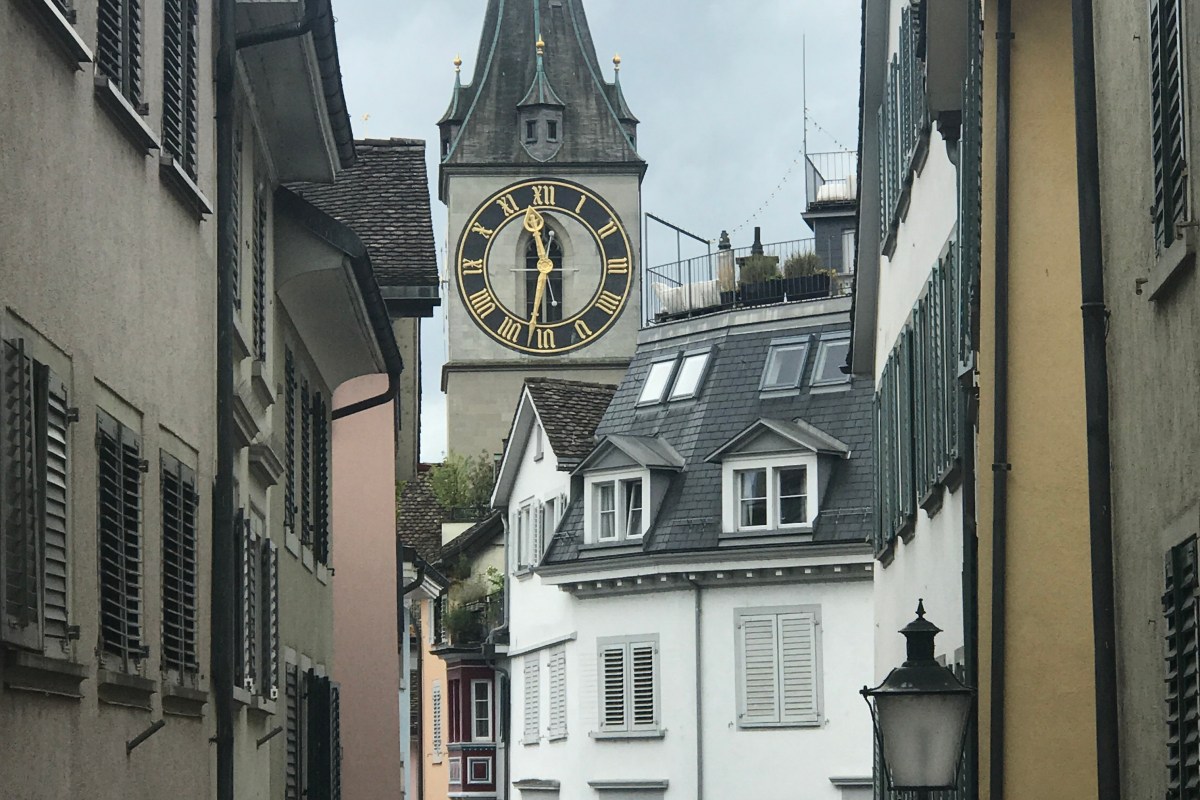 clock tower tall pointy church zurich switzerland