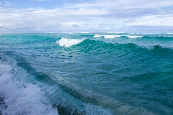 Blue Pacific Ocean waves crashing near Abaiang Island Kiribati